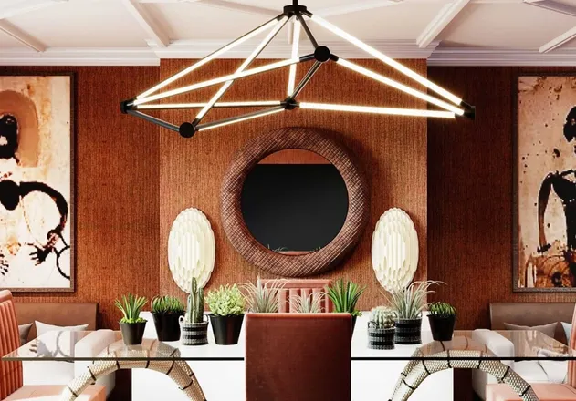 Terracotta dining room with a geometric brass chandelier